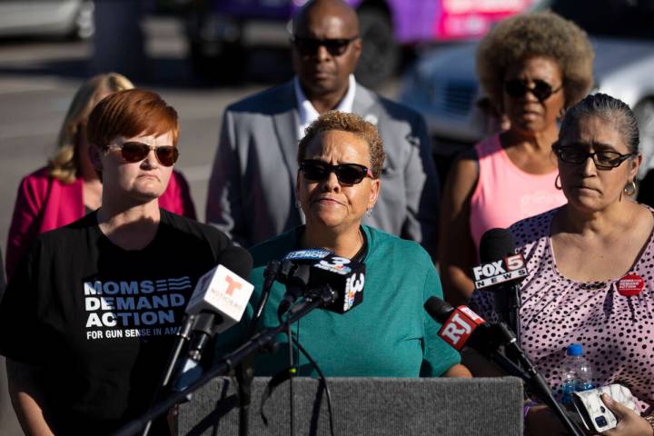 Nevada State Sen. Pat Spearman, center, surrounded by friends, family and supporters, holds a p ...