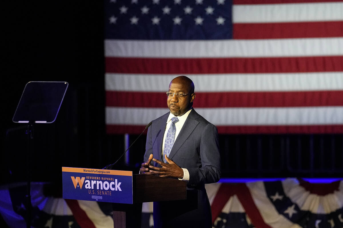 Democratic nominee for U.S Senate Sen. Raphael Warnock speaks during an election-night watch pa ...