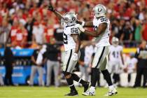 Raiders linebacker Denzel Perryman (52) celebrates with defensive end Clelin Ferrell (99) after ...