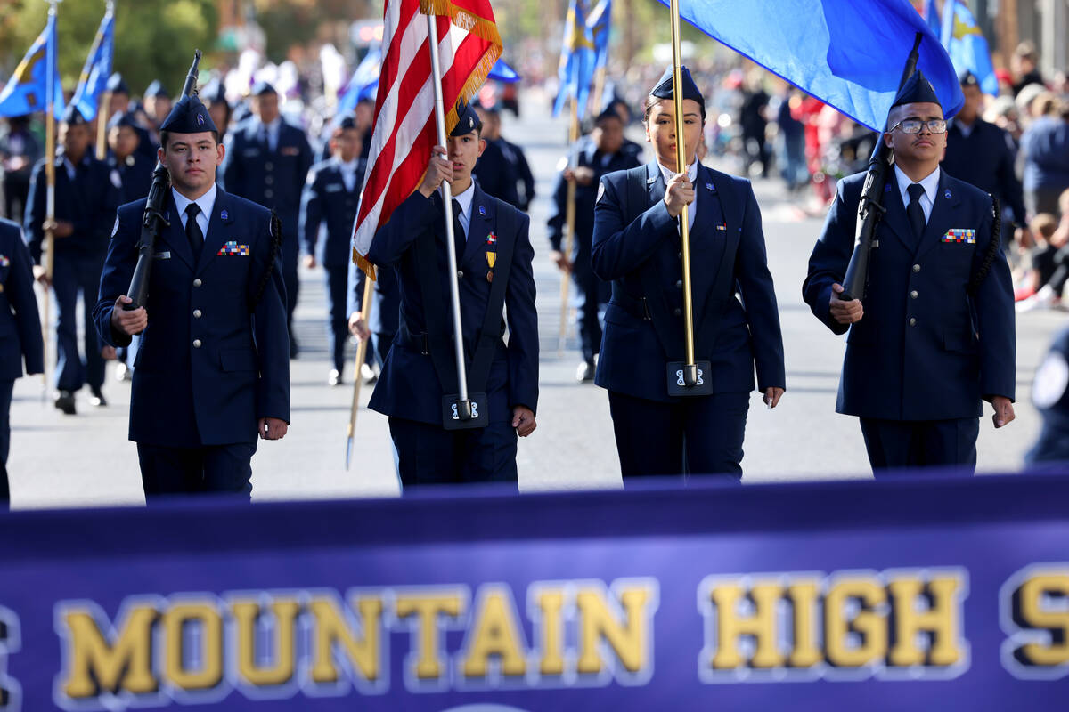 Members of the Sunrise Mountain High School Air Force Junior ROTC march in the Veterans Day par ...