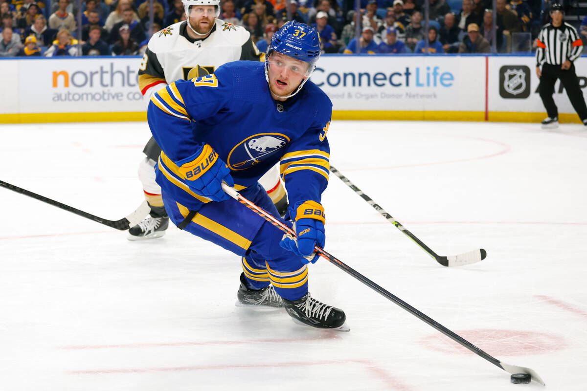 Buffalo Sabres center Casey Mittelstadt (37) carries the puck past Vegas Golden Knights center ...