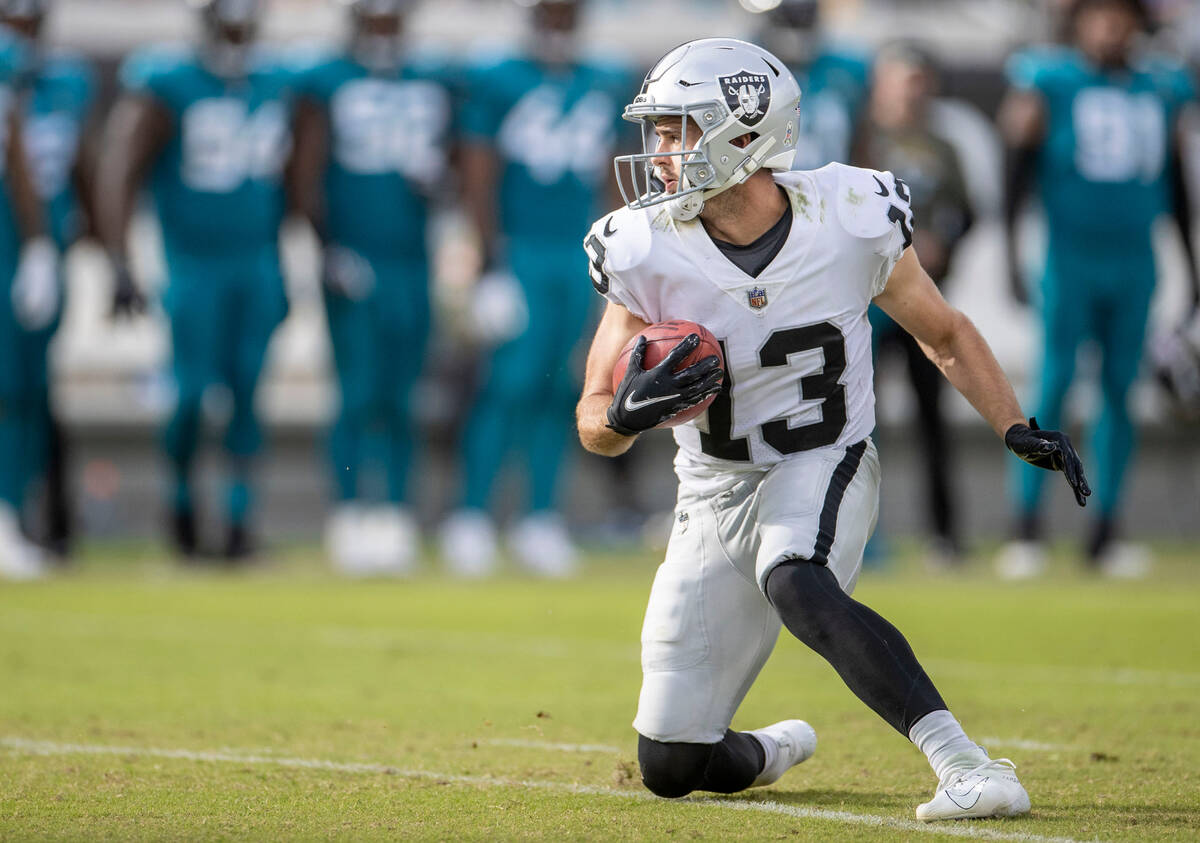 Raiders wide receiver Hunter Renfrow (13) looks for room to run on a punt return during the sec ...