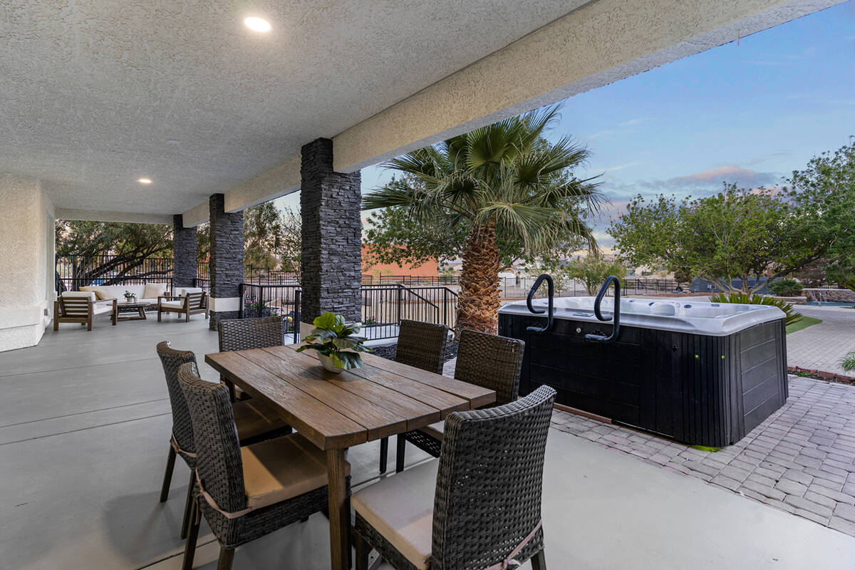 The outdoor kitchen and spa. (Sotheby’s International Realty)