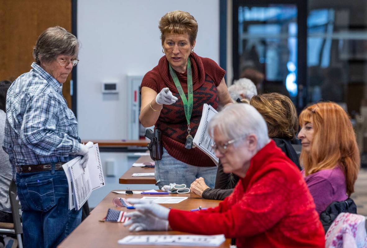 Another clarification is made as volunteers resume hand counting ballots in Nye County at the V ...