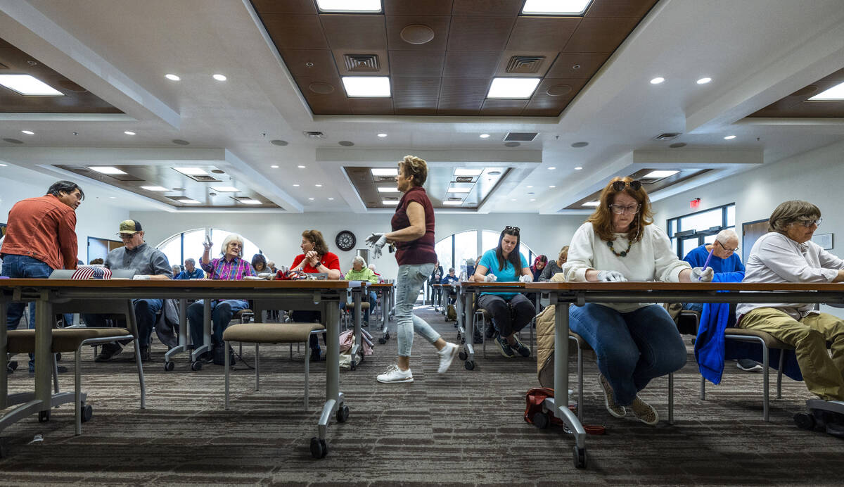 Volunteers resume hand counting ballots in Nye County at the Valley Conference Center on Thursd ...