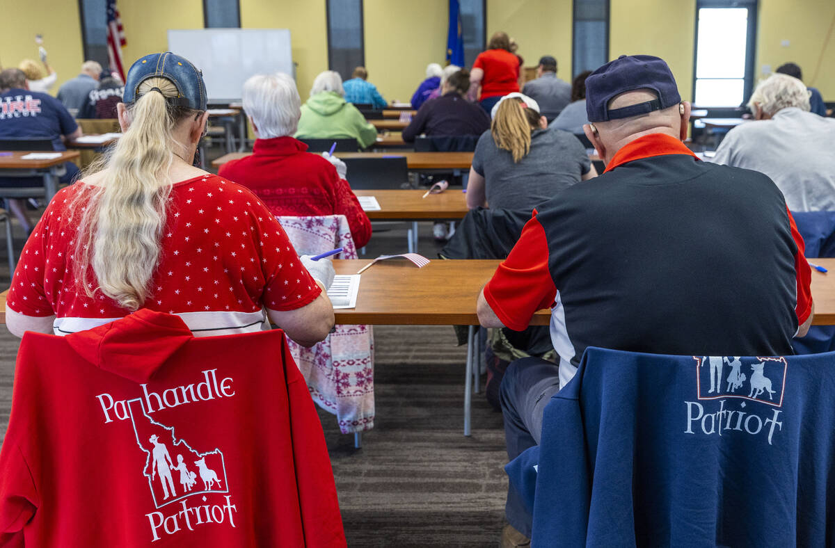 Volunteers resume hand counting ballots in Nye County at the Valley Conference Center on Thursd ...