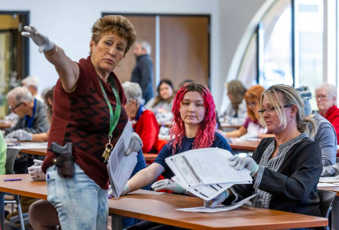 Instructions are given as volunteers resume hand counting ballots in Nye County at the Valley C ...