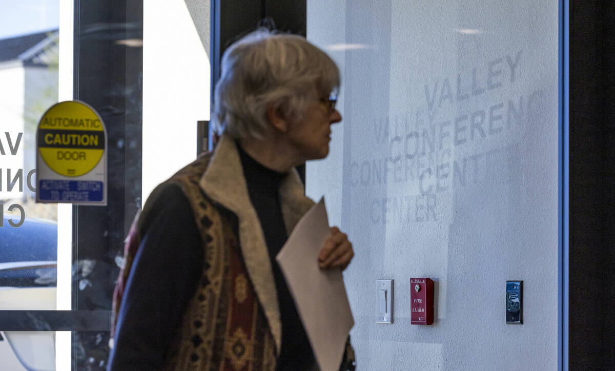 Another volunteer arrives as Nye County resumes hand counting ballots at the Valley Conference ...