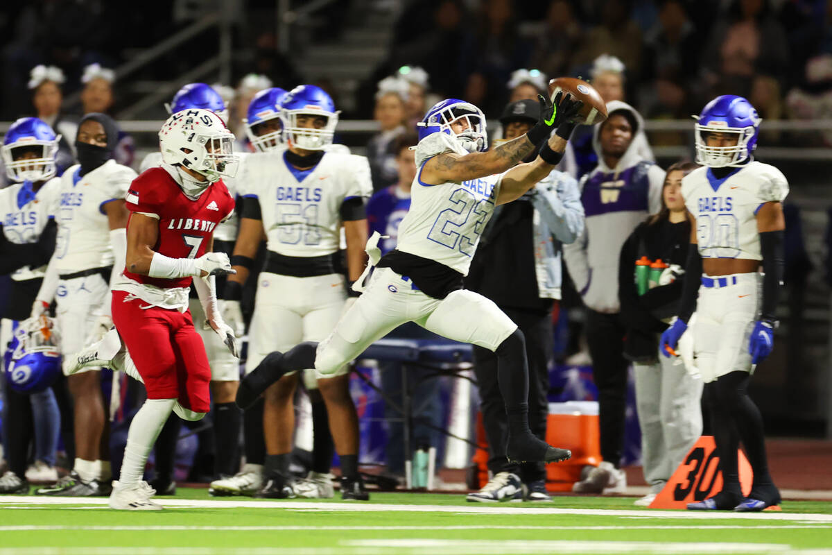 Bishop Gorman's Trech Kekahuna (23) rmisses the ball for an incomplete pass as Liberty's Jayden ...