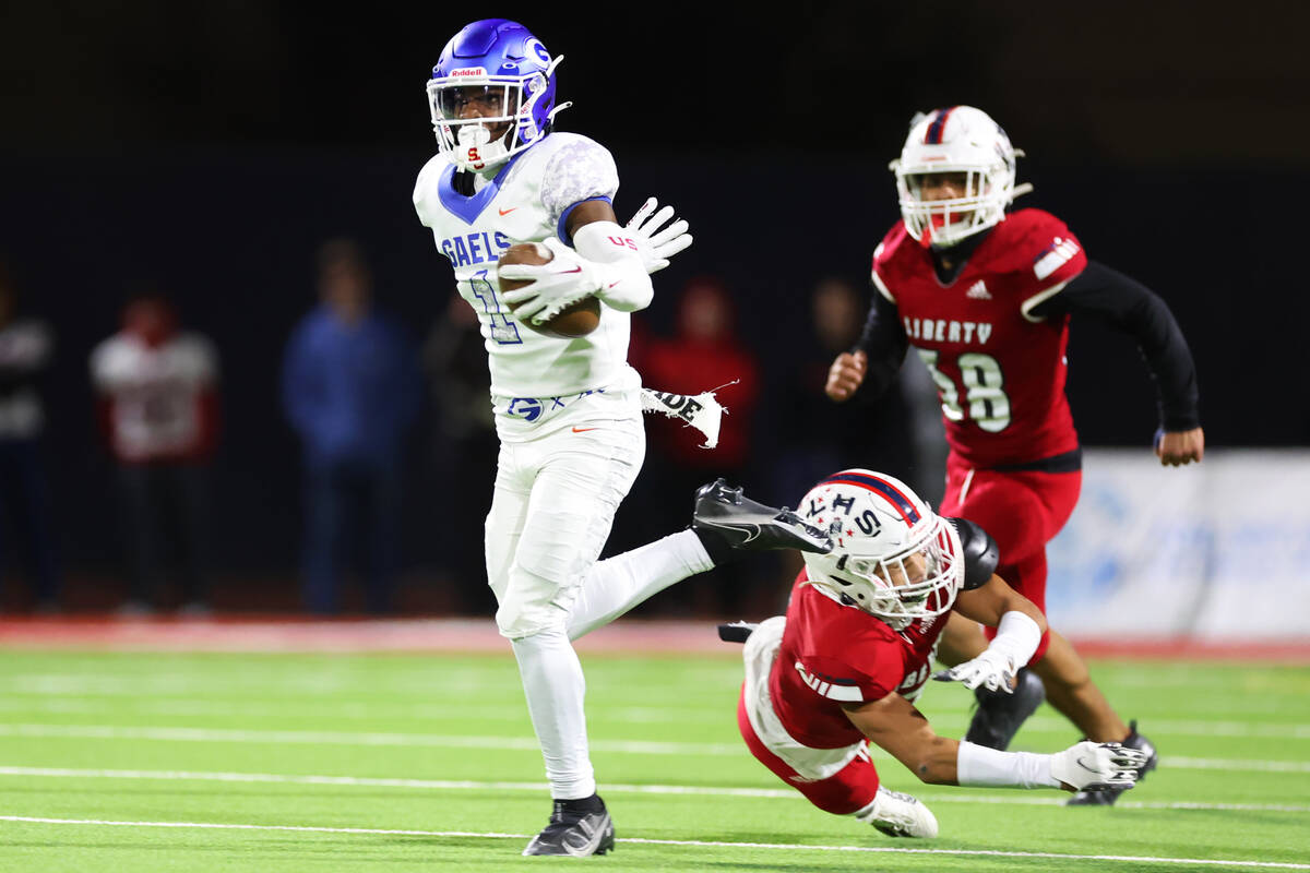 Bishop Gorman's Zachariah Branch (1) runs the ball against Liberty during the first half of the ...