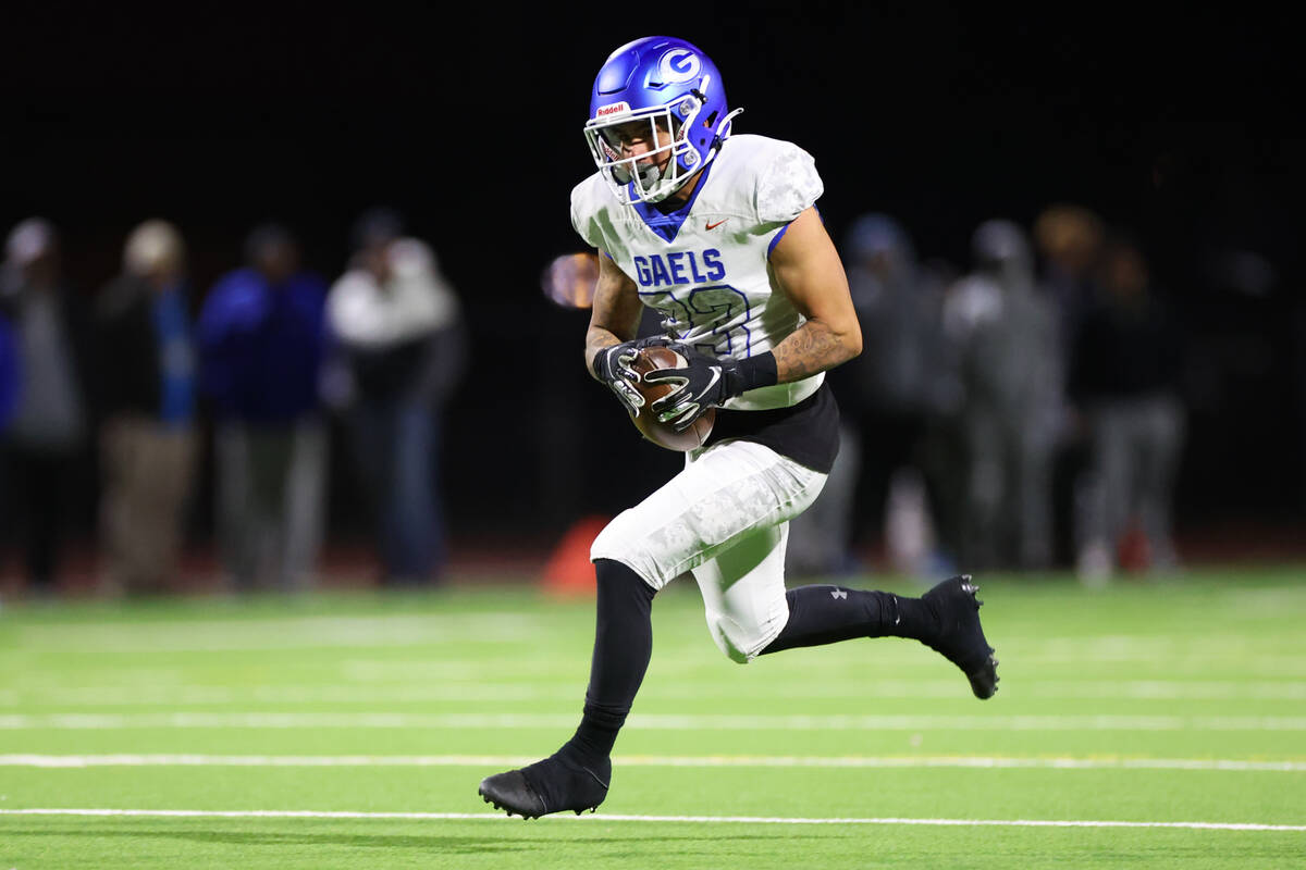 Bishop Gorman's Trech Kekahuna (23) makes a catch during the second half of the football 5A reg ...