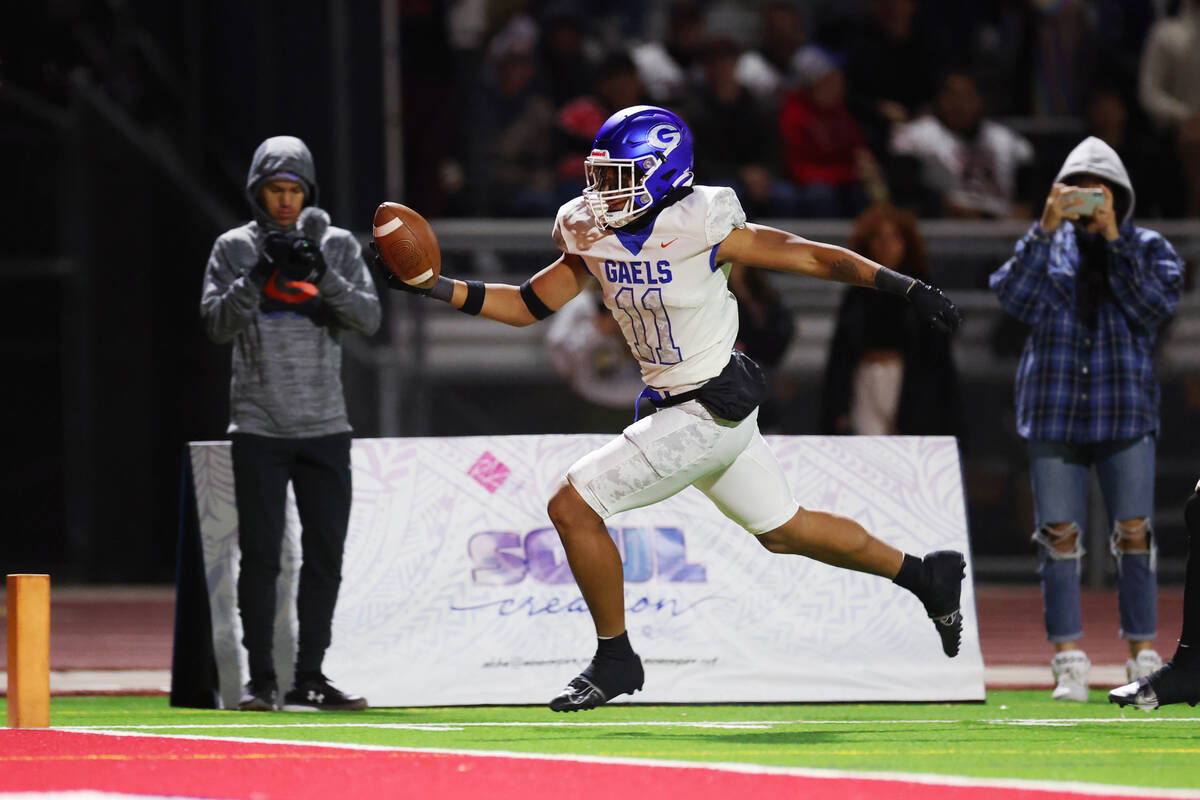 Bishop Gorman's Quincy Davis (11) returns a Liberty fumble for a touchdown during the first hal ...