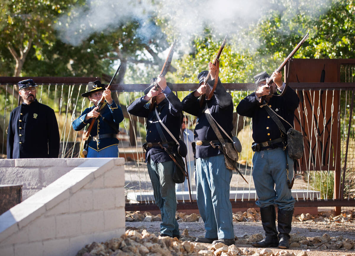 The Southern Nevada Living History Association fire their pioneer-era guns during a ceremony in ...