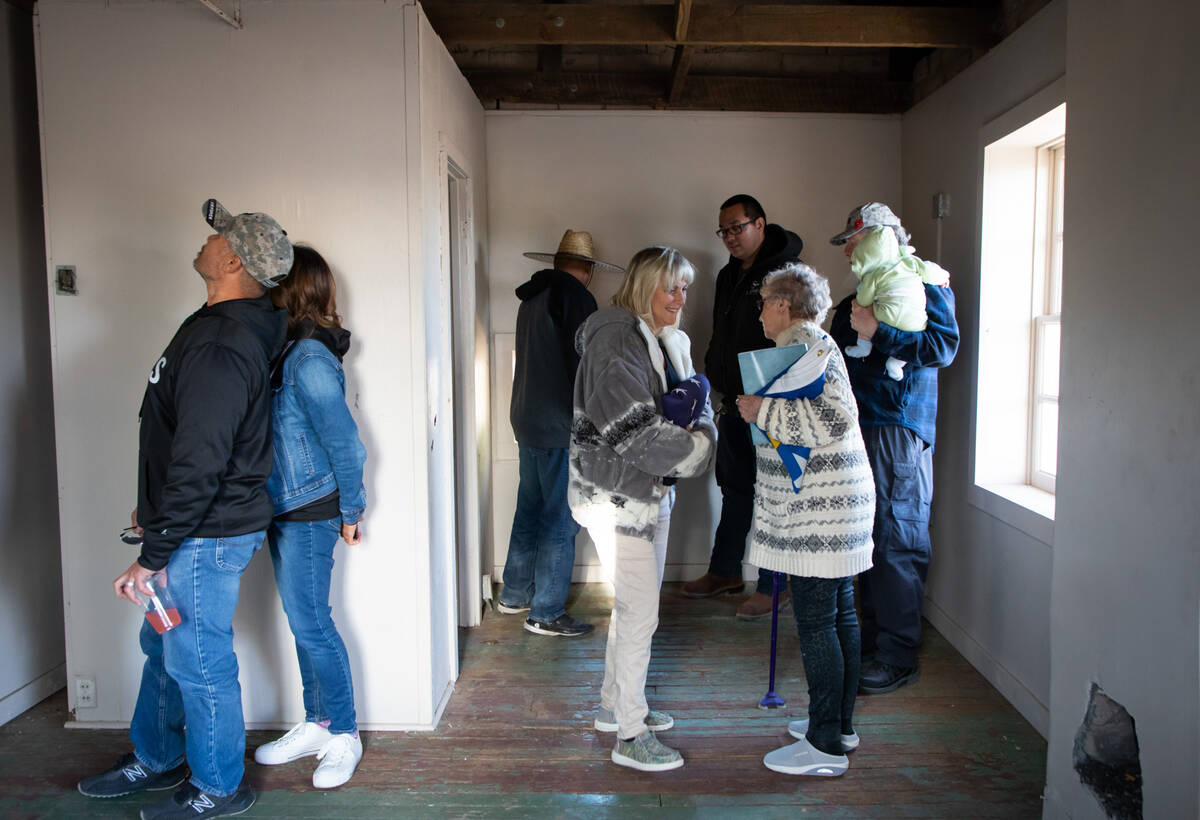 Colleen Herbst, left, and Patricia Reisbeck, right, talk to each other as people tour an old st ...