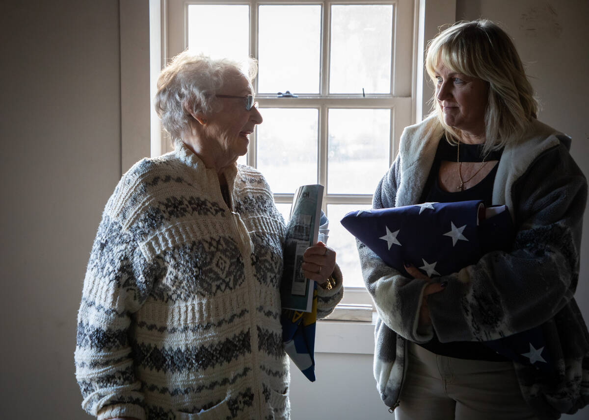 Colleen Herbst, right, and Patricia Reisbeck, left, talk as people tour the old house that is t ...