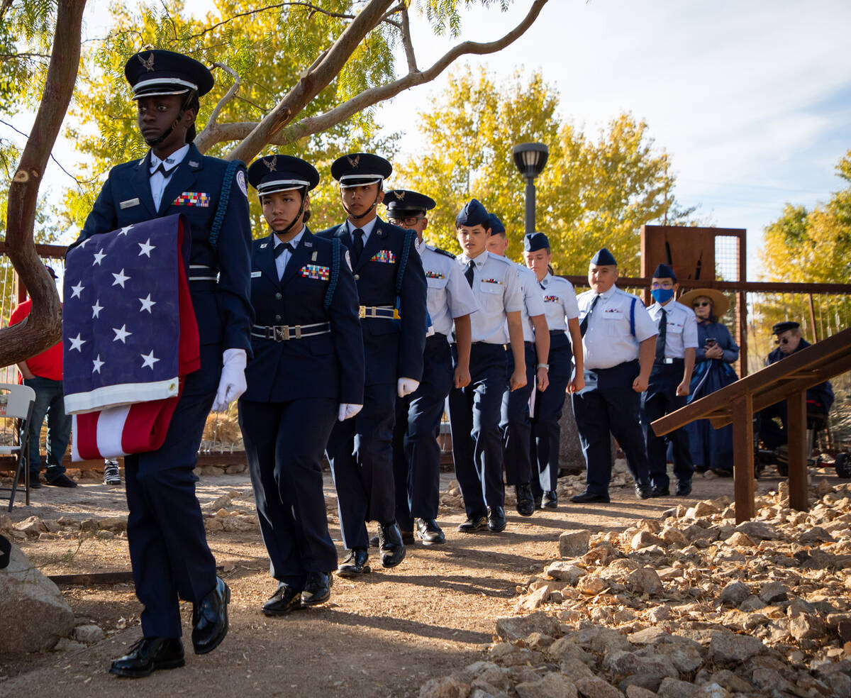 Members of Rancho High school Airfare Junior ROTC carry flags during a ceremony in honor of the ...