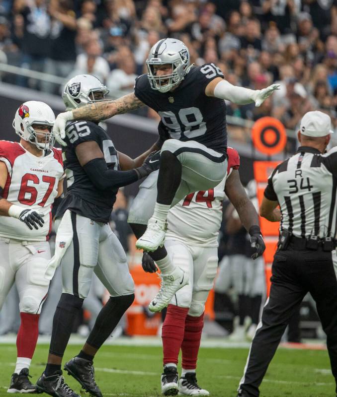 Raiders defensive end Maxx Crosby (98) celebrates his sack of Arizona Cardinals quarterback Kyl ...