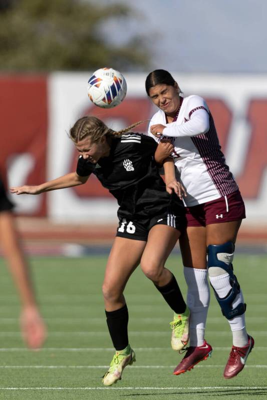 Galena’s Nyla Hensley (16) heads the ball against Faith Lutheran’s Andrea Leyva, ...