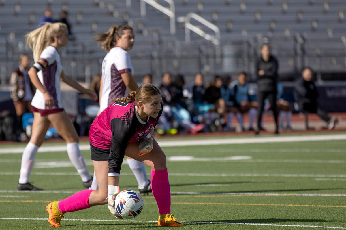 Faith Lutheran’s Elke Travis throws the ball back into play during a Class 5A girls high ...