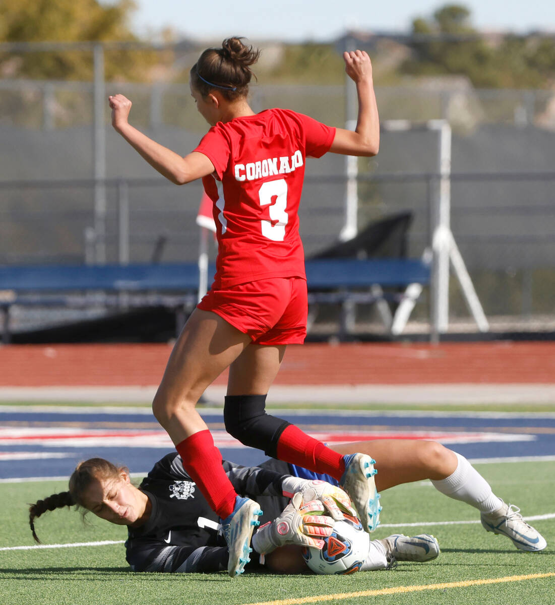 McQueen's High goalie Leah Nisenfeld denies Coronado High Liliana Schuth's (3) attempt to score ...