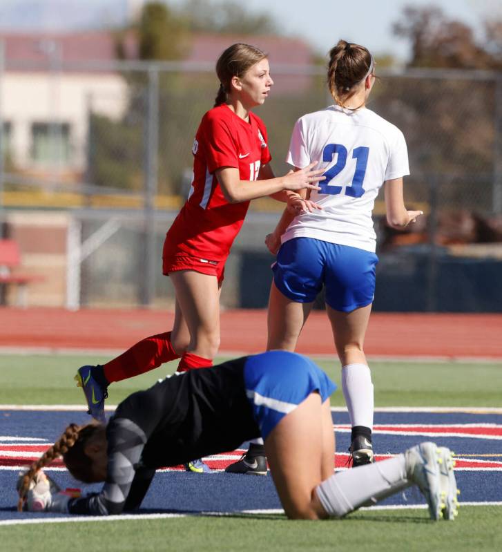 McQueen's High goalie Leah Nisenfeld concedes a goal scored by Coronado High's Tia Garr (12) du ...