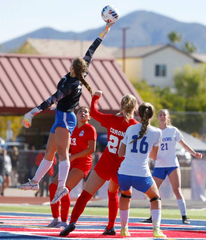 McQueen's High goalie Leah Nisenfeld deflects a corner kick from Coronado High's Cate Gusick (2 ...