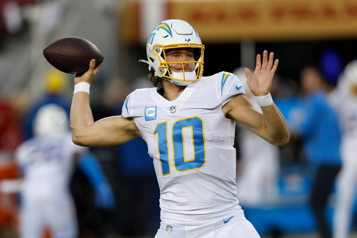 Los Angeles Chargers quarterback Justin Herbert (10) warms up before an NFL football game again ...