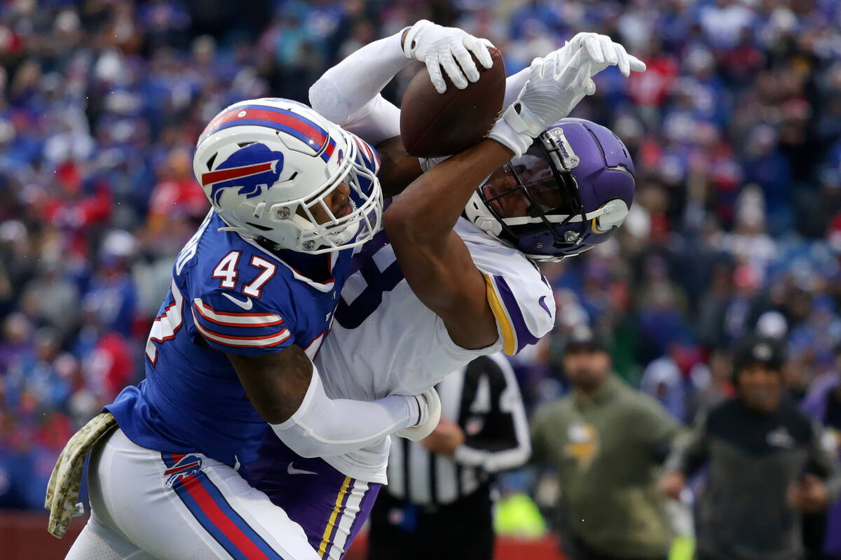 Buffalo Bills cornerback Christian Benford (47) brings down Minnesota Vikings wide receiver Jus ...