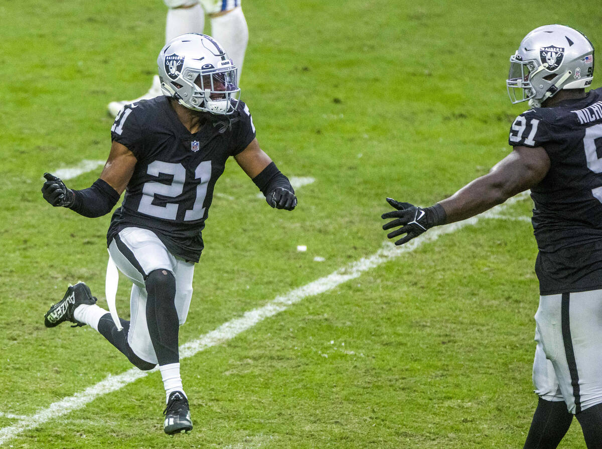 Raiders cornerback Amik Robertson (21) celebrates his big hit with an Indianapolis Colts wide r ...