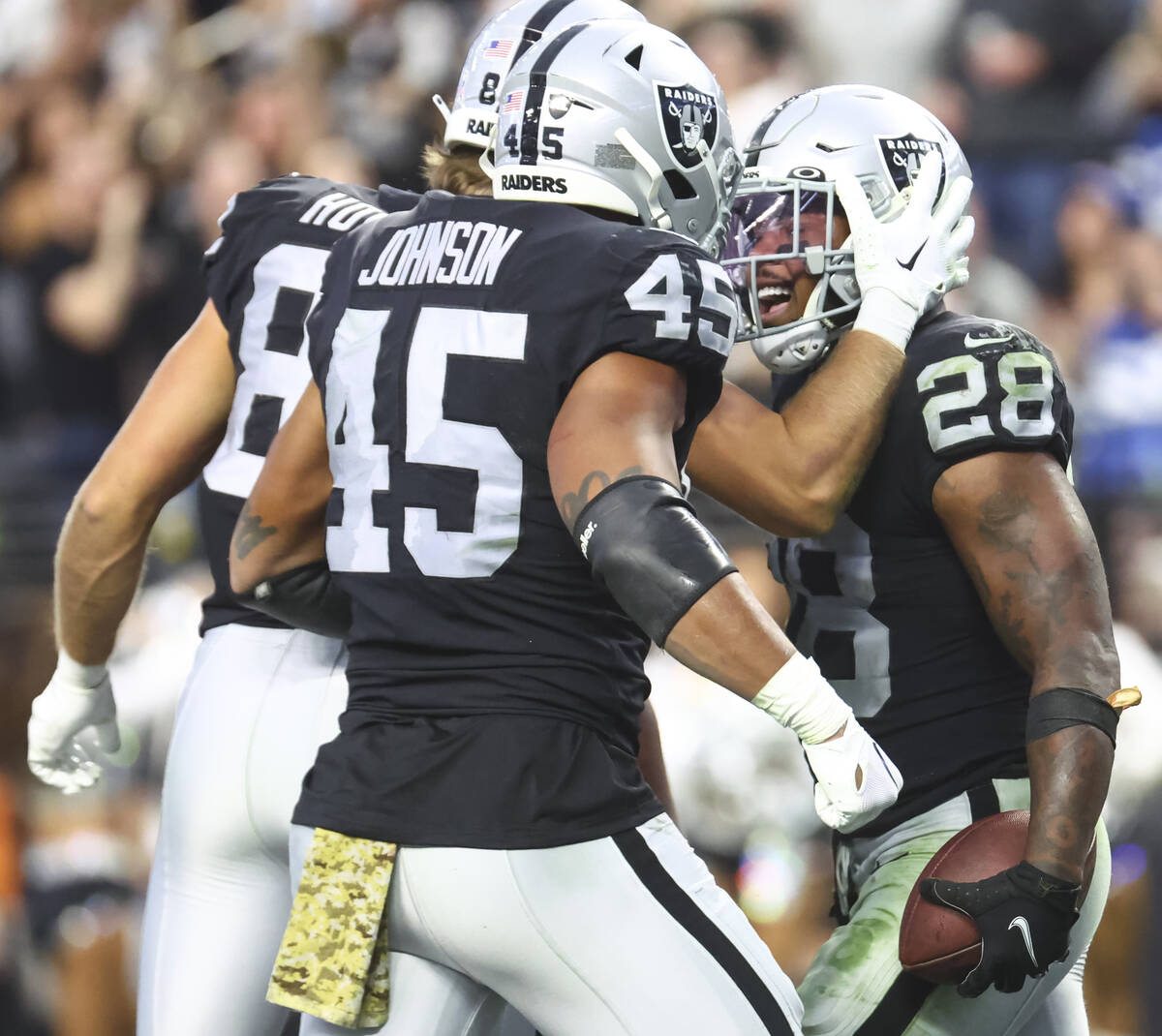 Raiders running back Josh Jacobs (28) celebrates his touchdown with teammates during the second ...