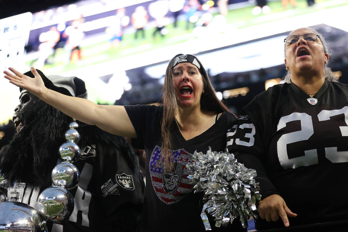 Fans react after the Raiders failed attempt to score in their last drive of the second half of ...