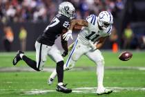Raiders cornerback Sam Webb (27) forces a fumble by Indianapolis Colts wide receiver Michael Pi ...