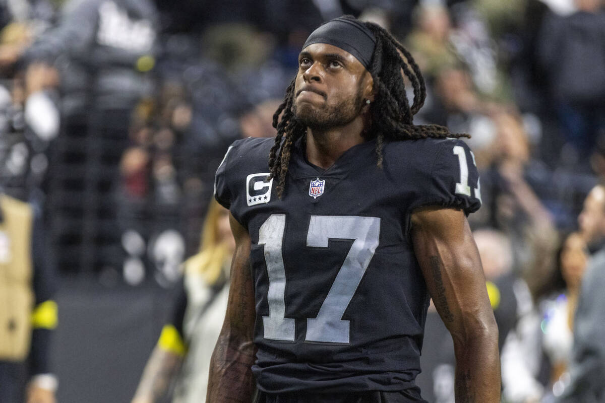 Raiders wide receiver Davante Adams (17) walks off the field after the team lost an NFL game, 2 ...