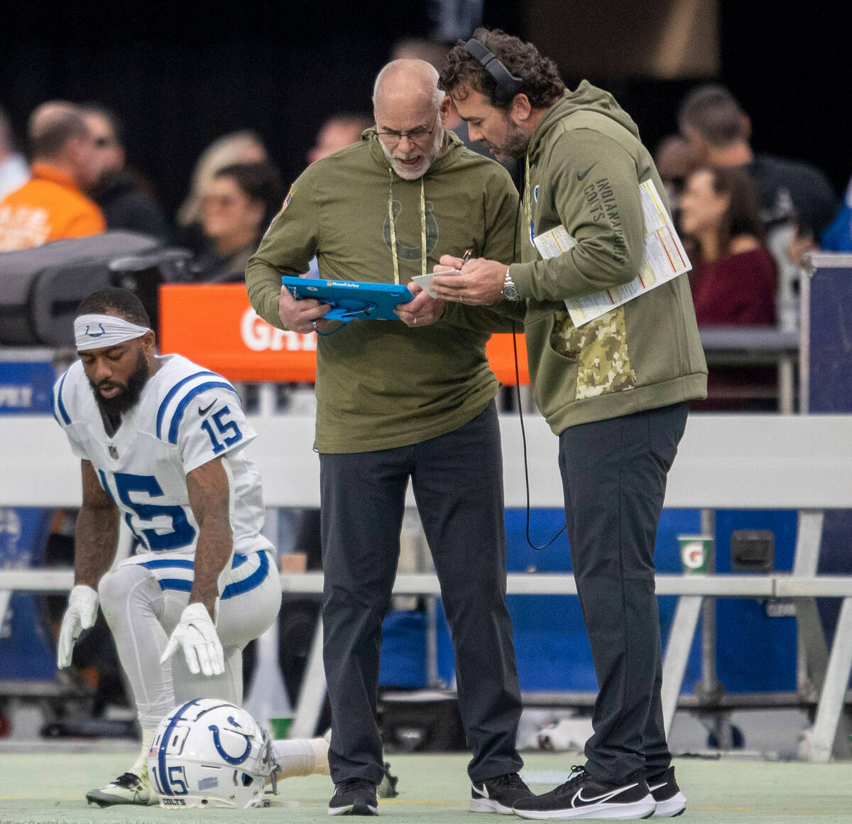 Indianapolis Colts head coach Jeff Saturday, right, looks at a replay during the first half of ...
