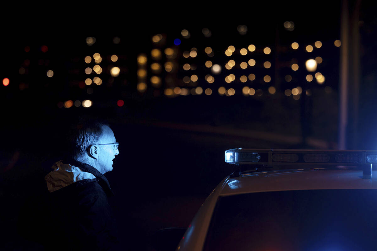 A medical examiner, who declined to give his name, arrives on the scene during an active shoote ...