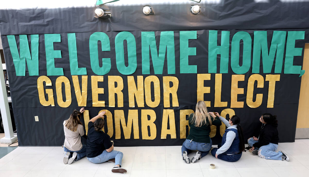 Students make a banner for Nevada Gov.-elect Sheriff Joe Lombardo before his victory speech at ...