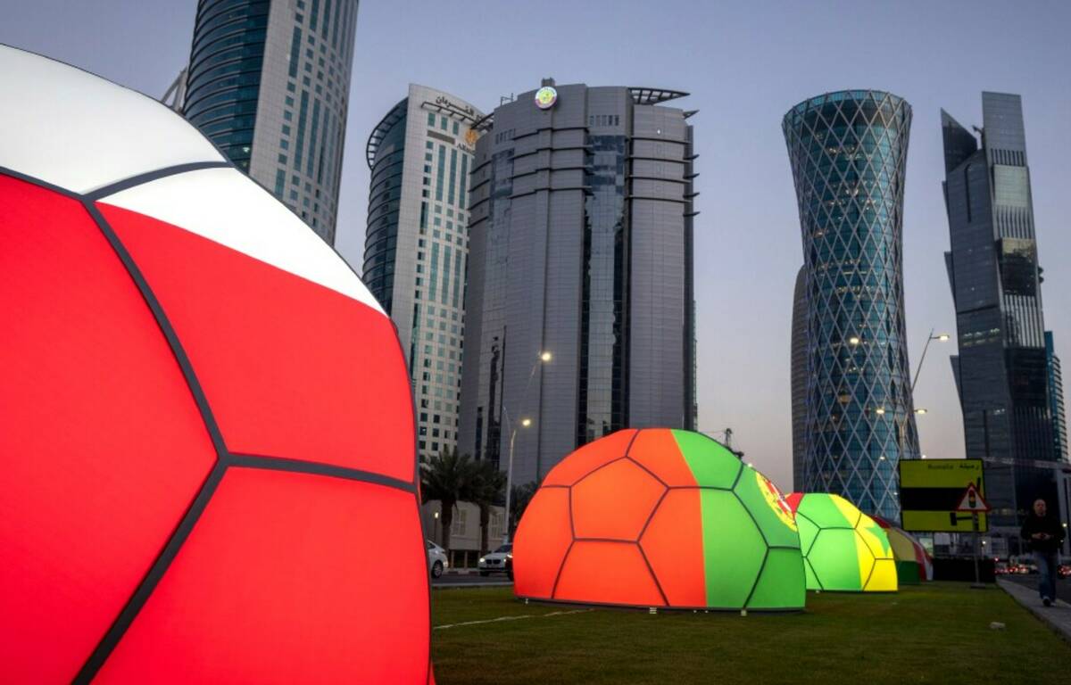 Domes featuring different national colors are displayed near the Doha Exhibition and Convention ...