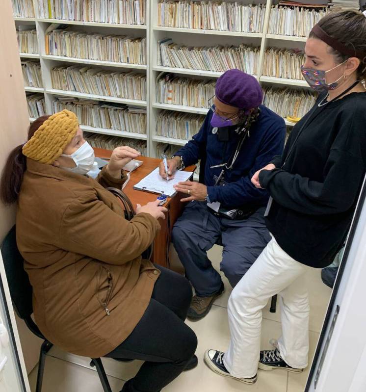 Las Vegas registered nurse Eduardo Resto, middle, treats patients in Ukraine as part of a volun ...