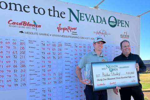 Preston Stanley, left, is presented with the winner's check at the 2022 Nevada Open in Mesquite ...