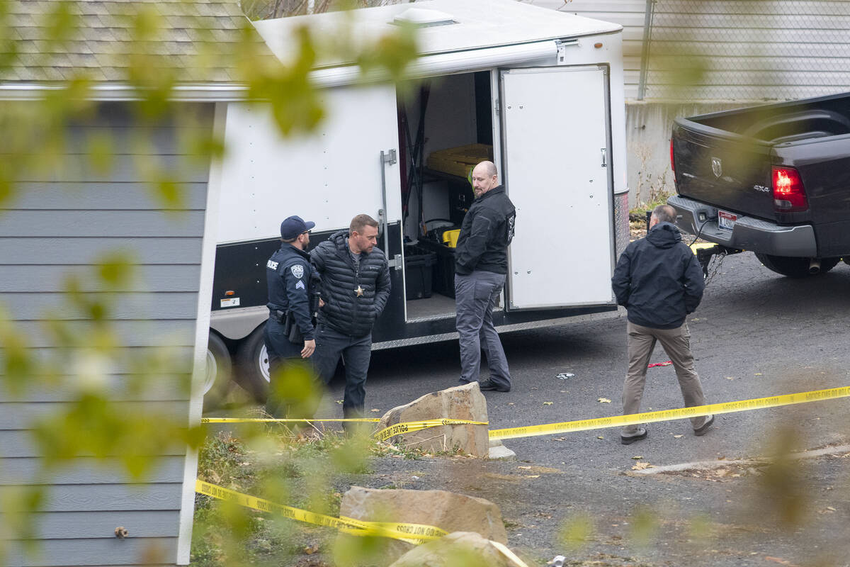 Officers investigate a homicide at an apartment complex south of the University of Idaho campus ...
