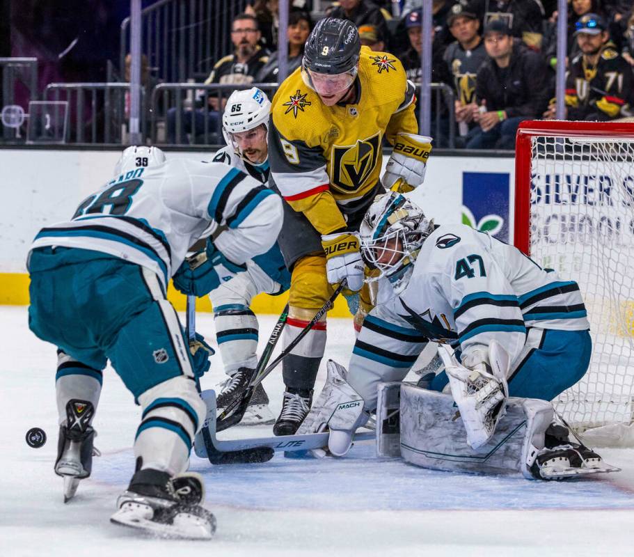 Golden Knights right wing Keegan Kolesar (55) eyes the puck close in as San Jose Sharks goalten ...