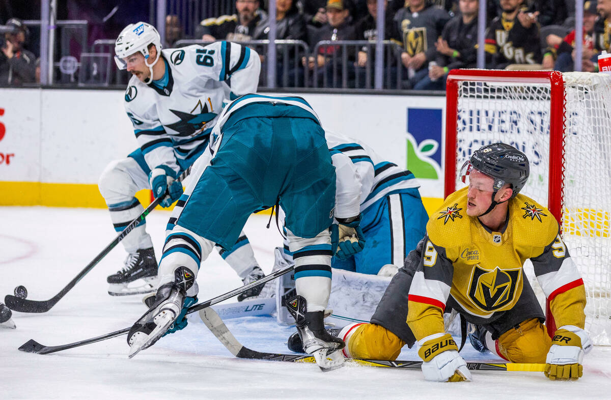 Golden Knights right wing Keegan Kolesar (55) eyes the puck getting away as San Jose Sharks goa ...