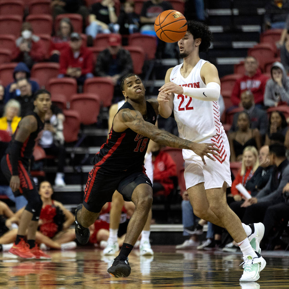 UNLV Rebels guard Luis Rodriguez (15) steals the ball from Dayton Flyers forward Mustapha Amzil ...