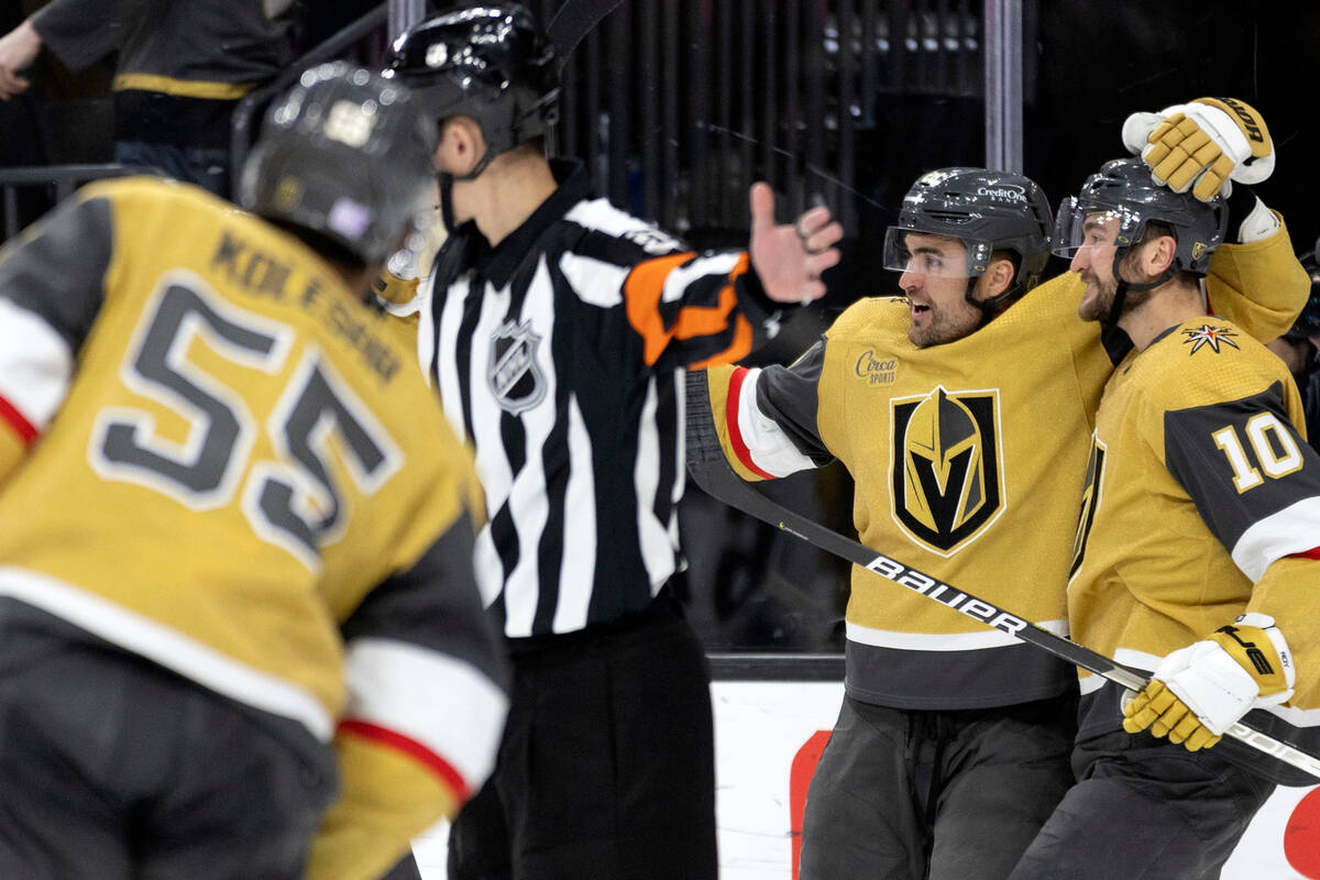 Golden Knights left wing William Carrier (28) and center Nicolas Roy (10) celebrate after Carri ...