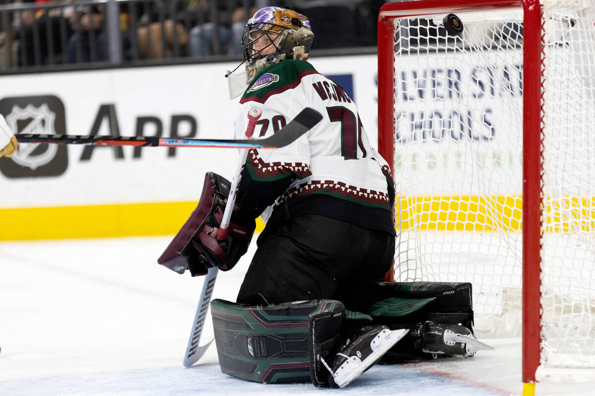 Golden Knights right wing Mark Stone, at left out of frame, scores a goal on Coyotes goaltender ...