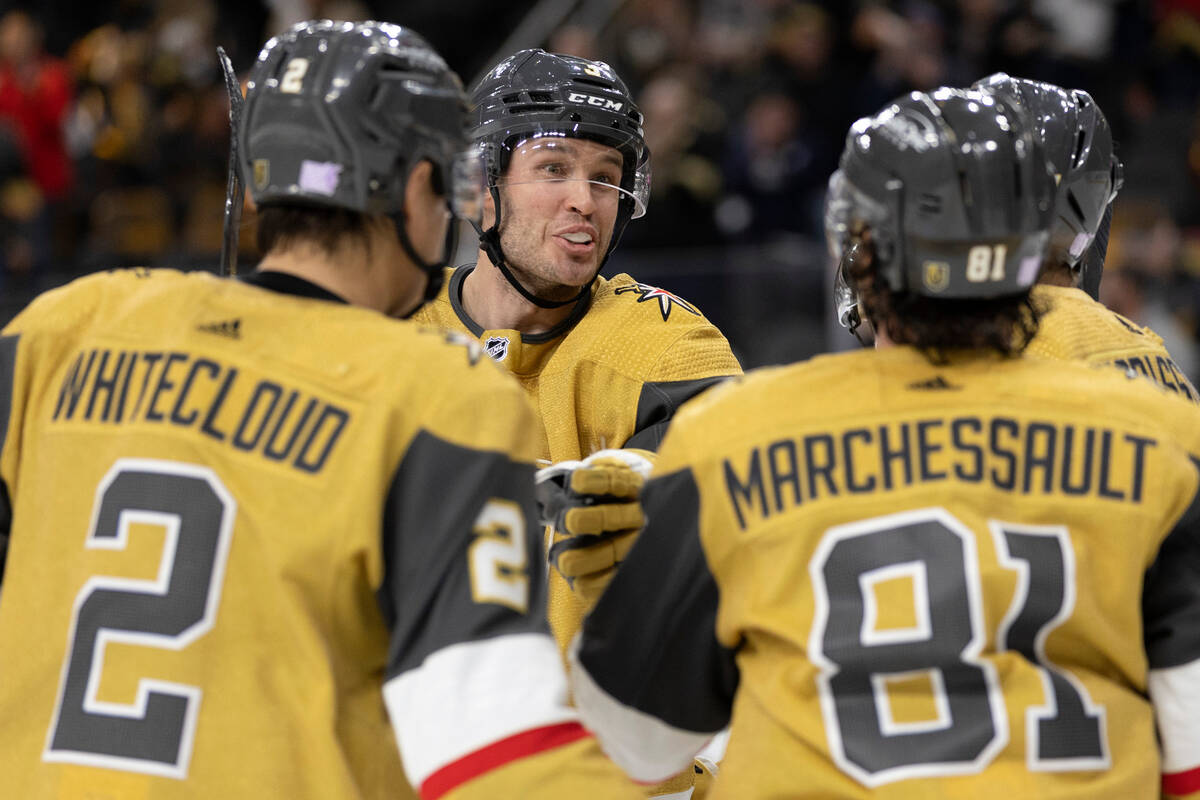 Golden Knights defenseman Brayden McNabb, center, congratulates his teammates after right wing ...