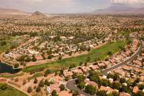 An aerial image shows homes and a golf course in the Summerlin community as some homeowner asso ...