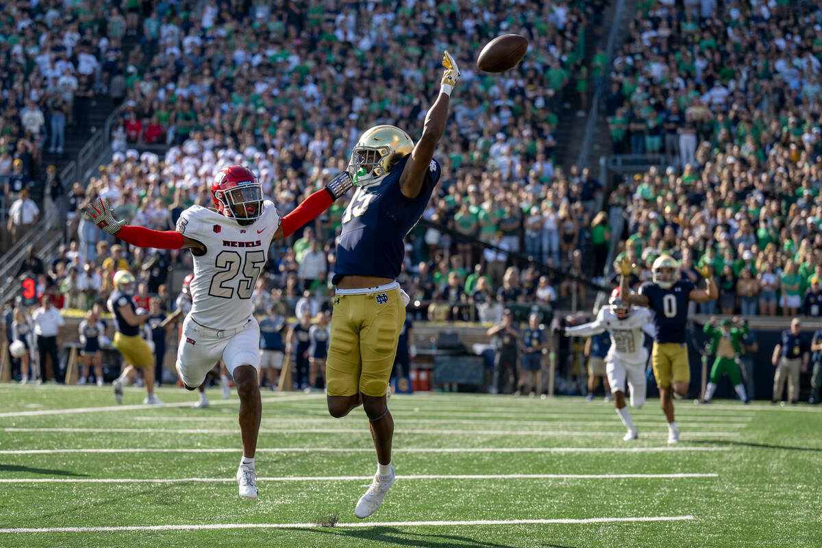 Notre Dame wide receiver Tobias Merriweather (15) misses a pass in front of UNLV defensive back ...