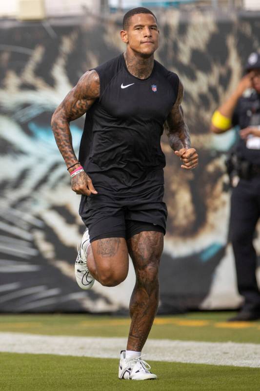 Raiders tight end Darren Waller warms up before an NFL game against the Jacksonville Jaguars at ...