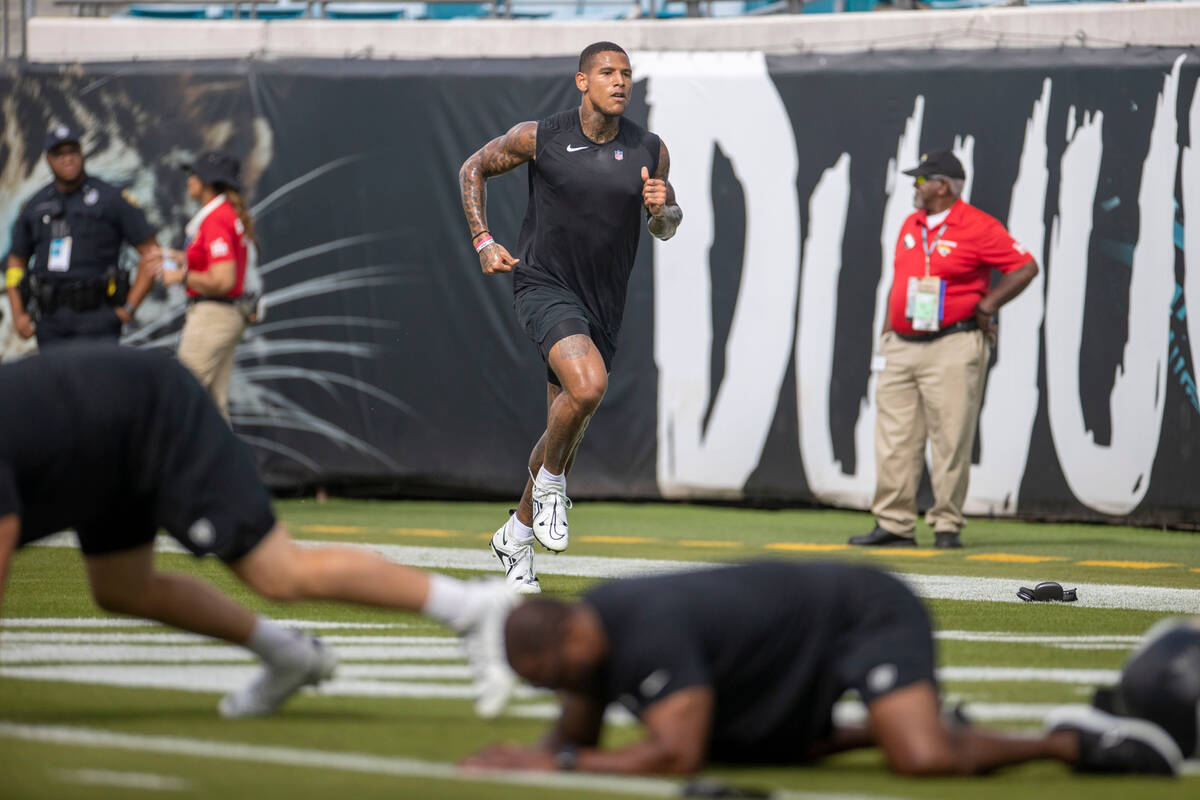 Raiders tight end Darren Waller warms up before an NFL game against the Jacksonville Jaguars at ...